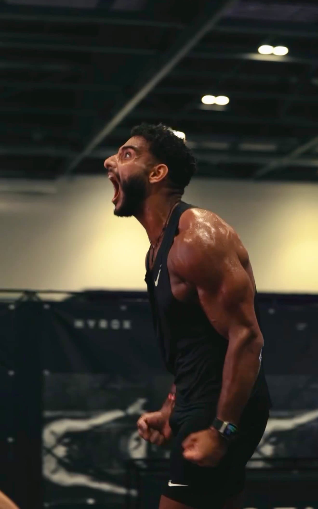 Ahmed celebrating at the finish line